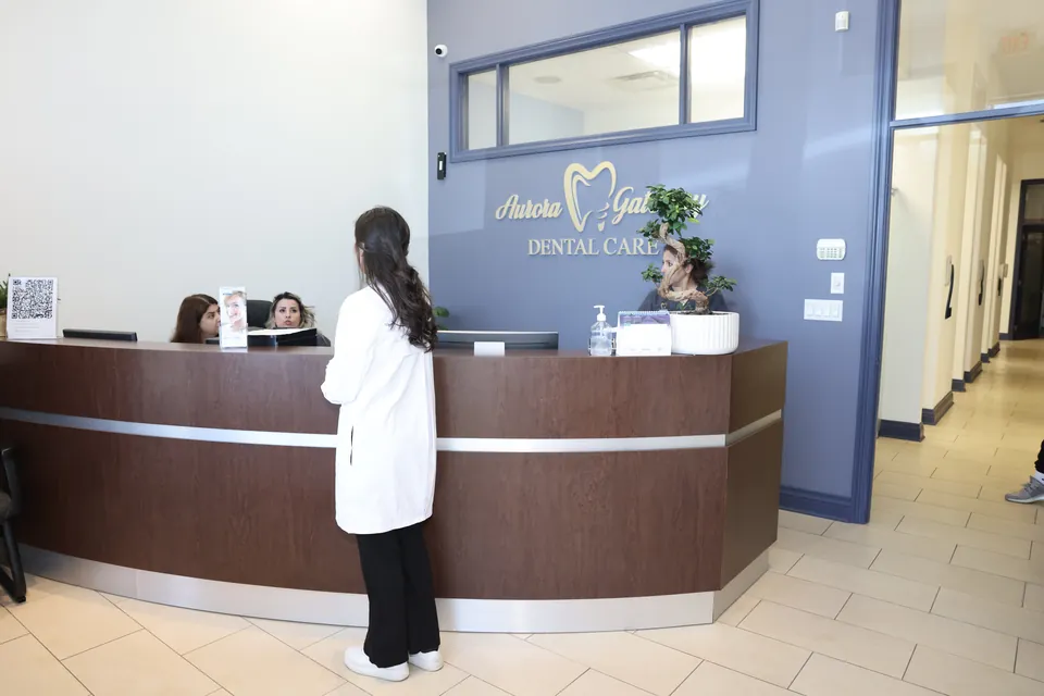 A team member at the front desk where insurance is billed directly