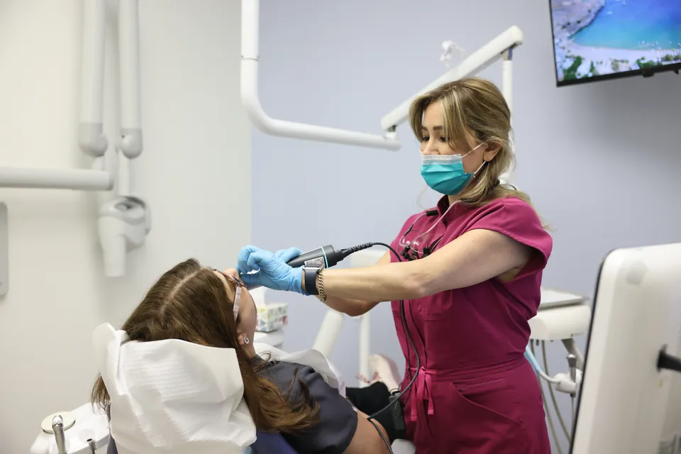 A patient chats with a team member during a family checkup