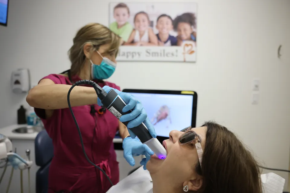 A patient relaxes in the chair during a visit at Aurora Gateway Dental Care